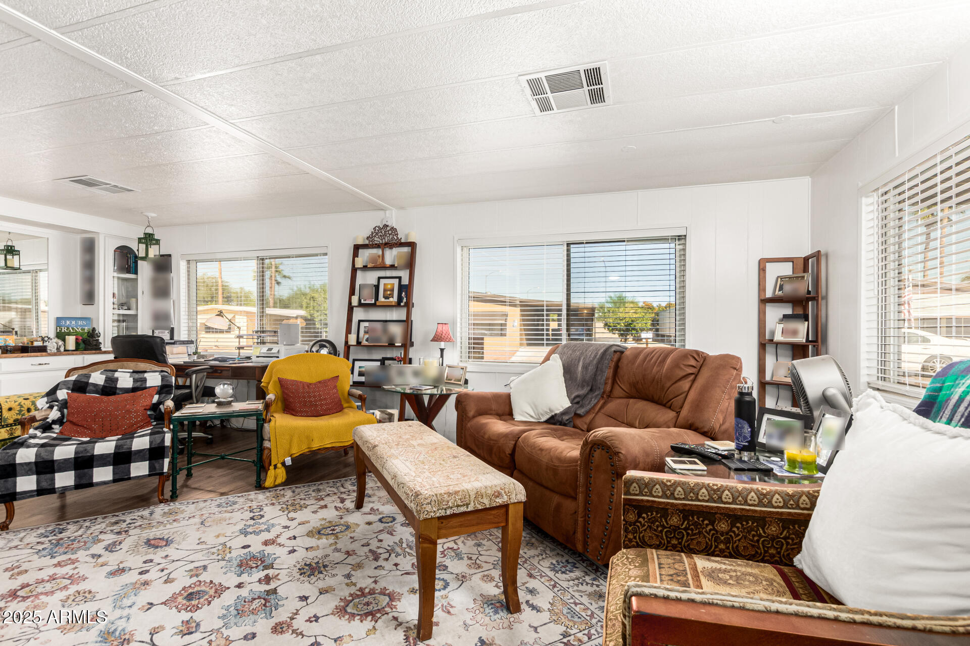 661 South Hawes Road, Unit 52 Mesa, AZ 85208 - Photo 9 of 36 a living room with furniture and wooden floor