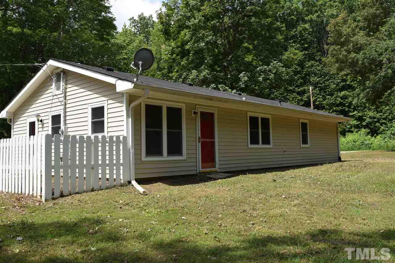89 Mountain Ridge Road Rougemont, NC 27572 - Photo 1 of 16 a view of a house with a yard