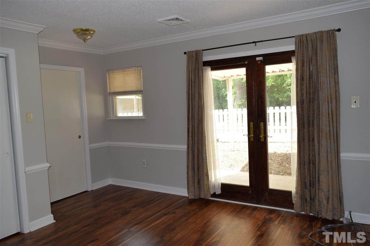 89 Mountain Ridge Road Rougemont, NC 27572 - Photo 12 of 16 a view of an empty room with wooden floor and a window