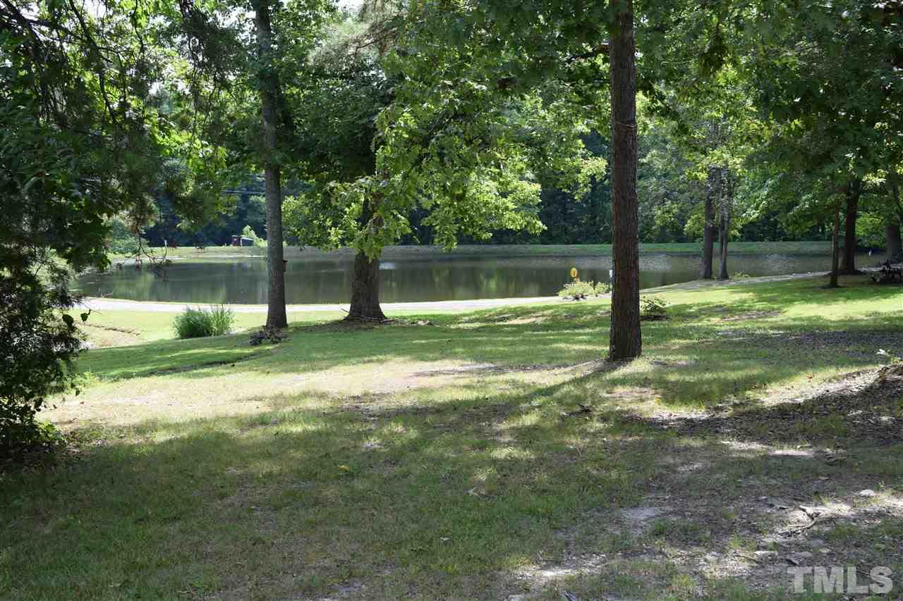 89 Mountain Ridge Road Rougemont, NC 27572 - Photo 5 of 16 a swimming pool with wooden fence