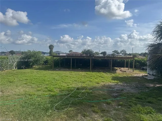 a backyard of a house with lots of green space