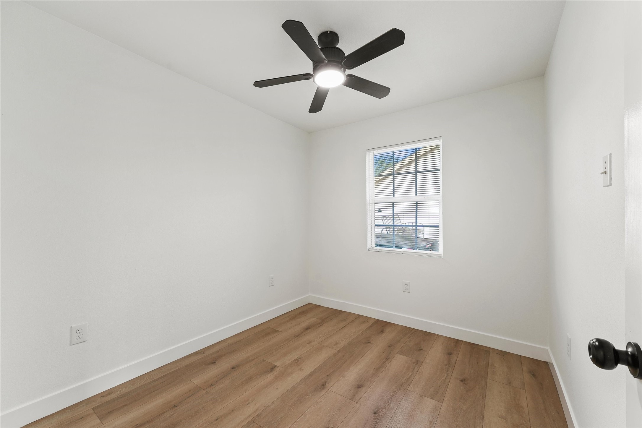 5406 Firefly Street Houston, TX 77017 - Photo 12 of 29 wooden floor in an empty room with a window