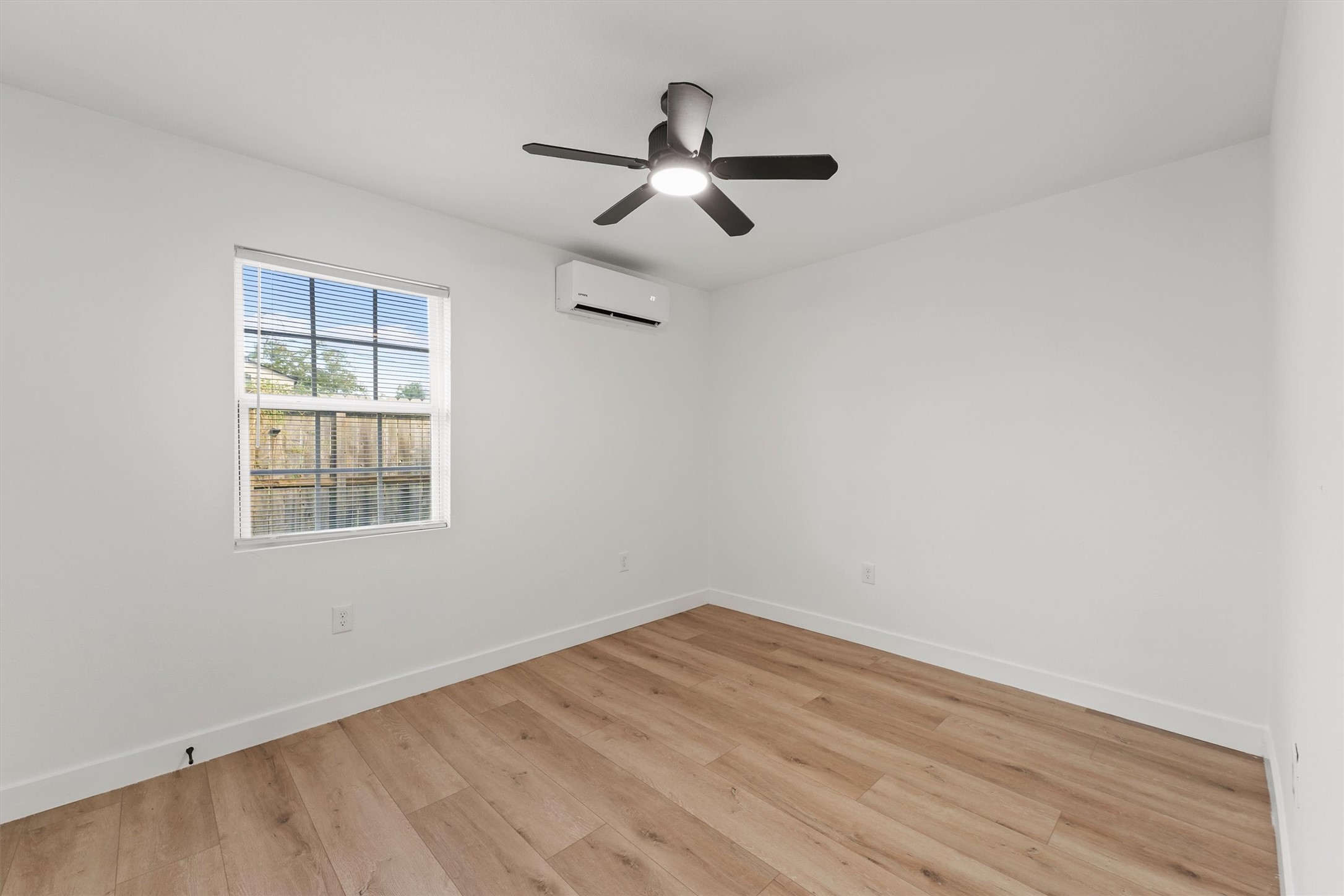 5406 Firefly Street Houston, TX 77017 - Photo 16 of 29 wooden floor in an empty room with a window