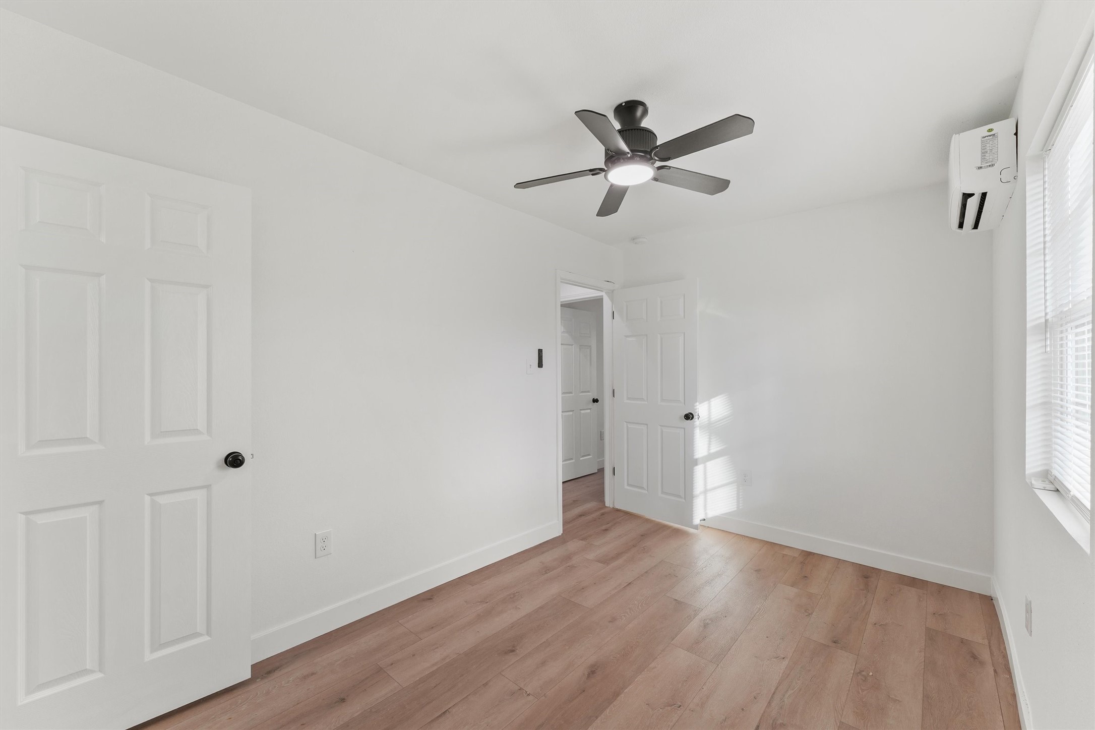5406 Firefly Street Houston, TX 77017 - Photo 20 of 29 a view of empty room with wooden floor and window