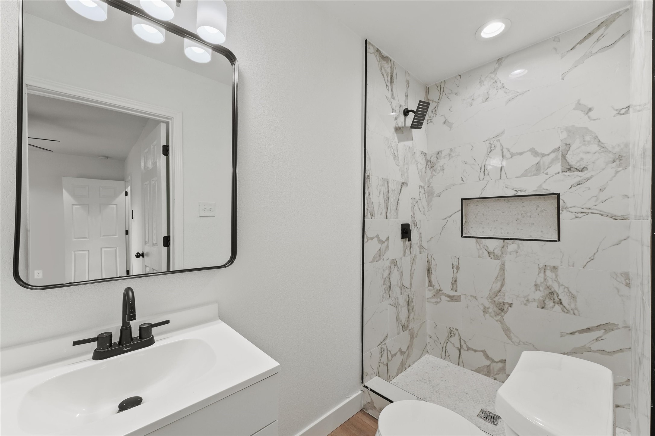5406 Firefly Street Houston, TX 77017 - Photo 21 of 29 a bathroom with a sink a toilet and shower