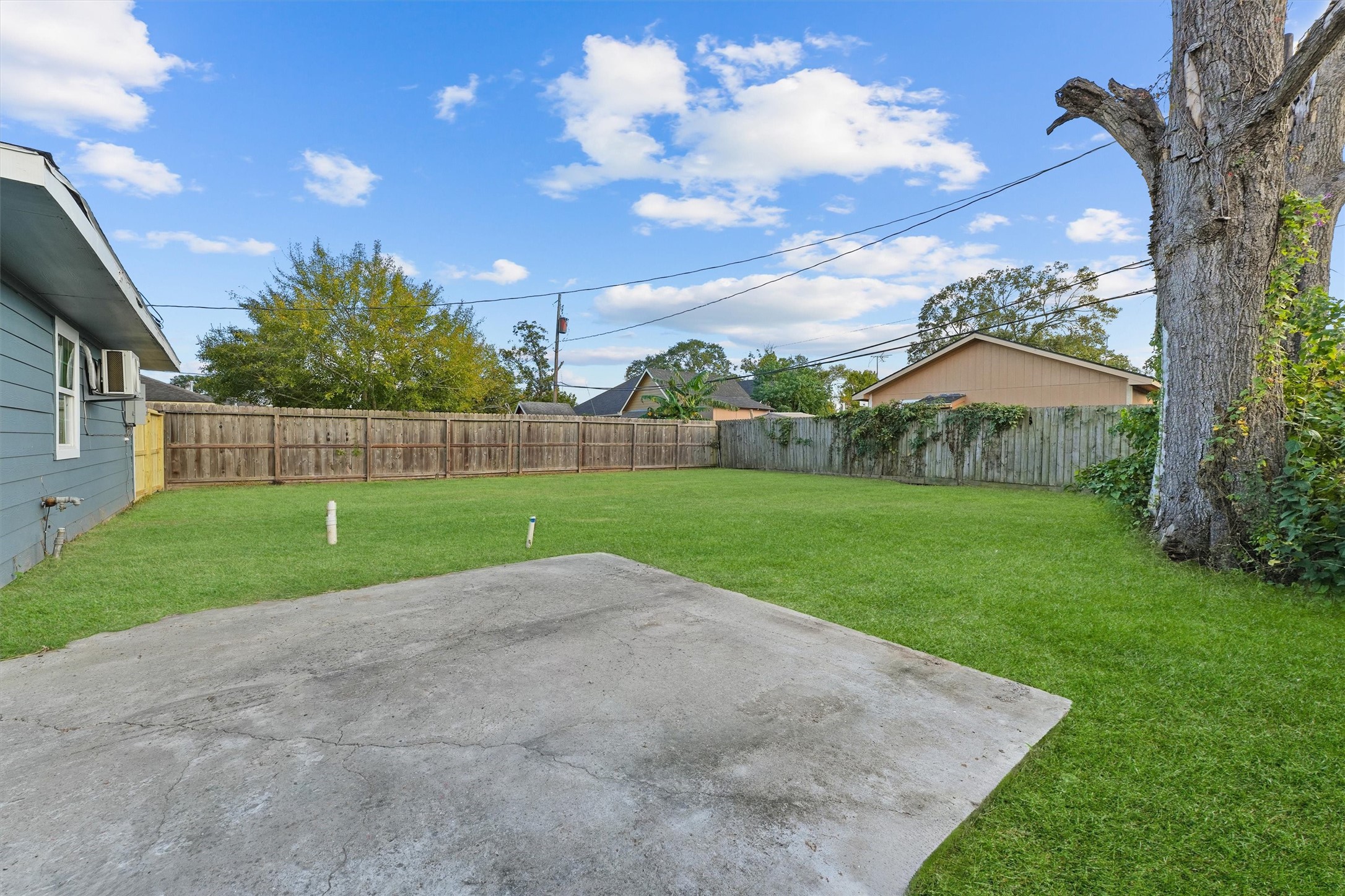 5406 Firefly Street Houston, TX 77017 - Photo 23 of 29 a view of grassy field with trampoline