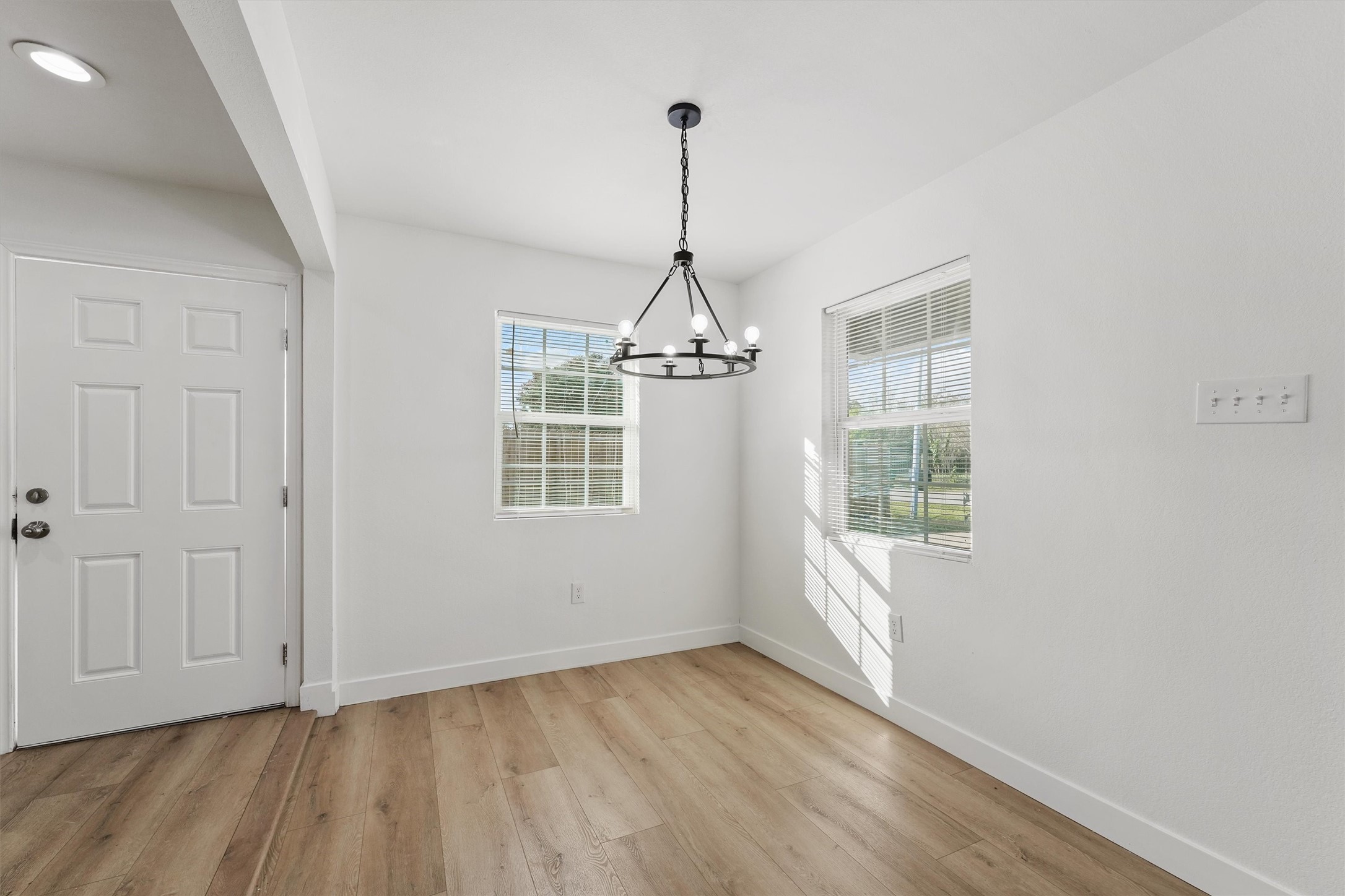5406 Firefly Street Houston, TX 77017 - Photo 3 of 29 a view of empty room with wooden floor and fan