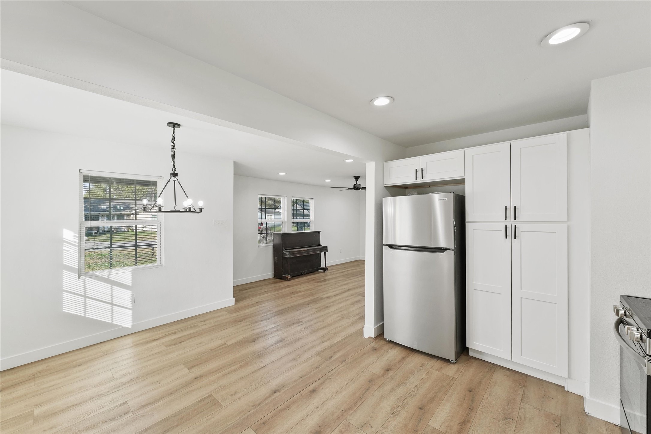 5406 Firefly Street Houston, TX 77017 - Photo 7 of 29 a view of kitchen with refrigerator and wooden floor