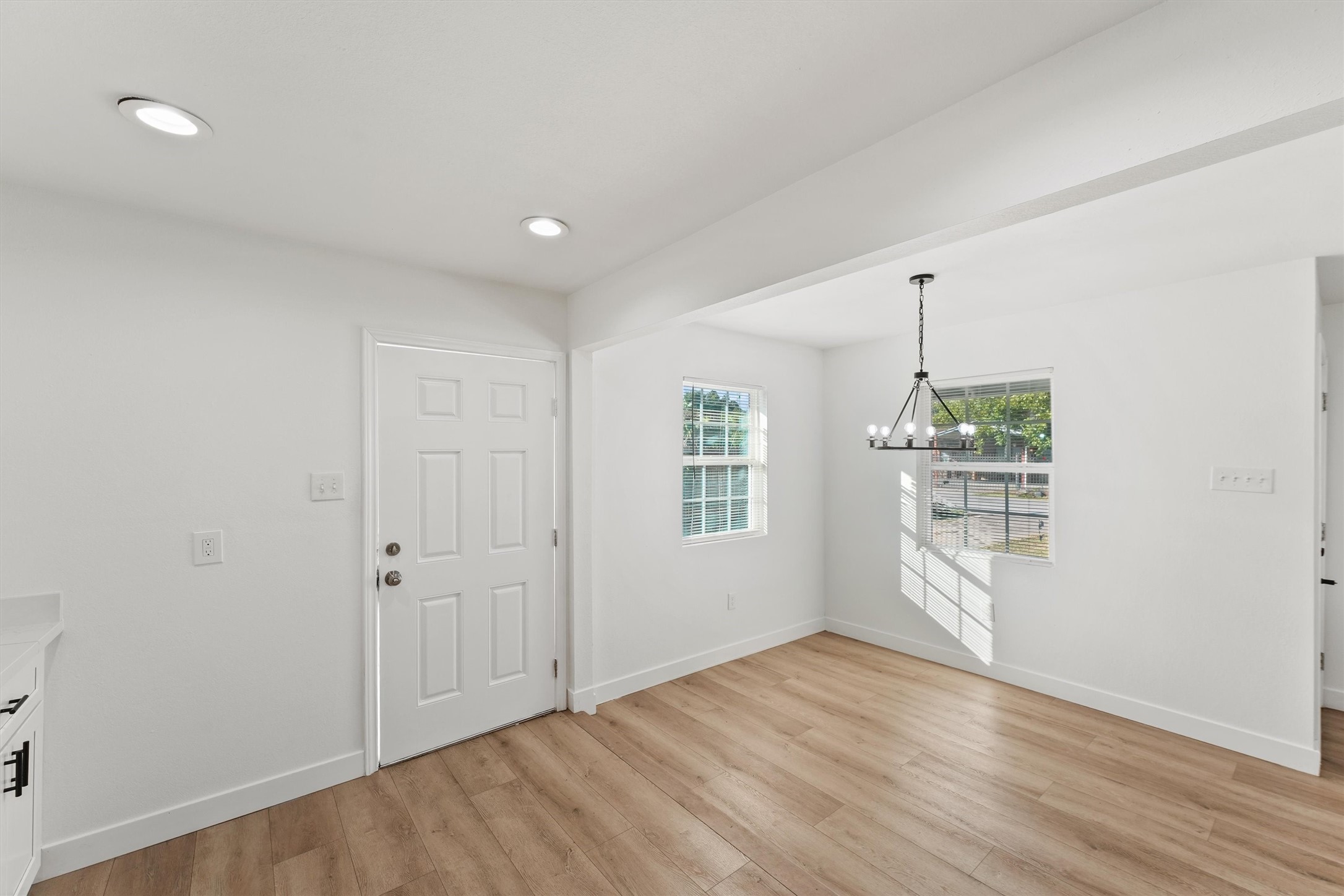 5406 Firefly Street Houston, TX 77017 - Photo 8 of 29 an empty room with wooden floor and windows