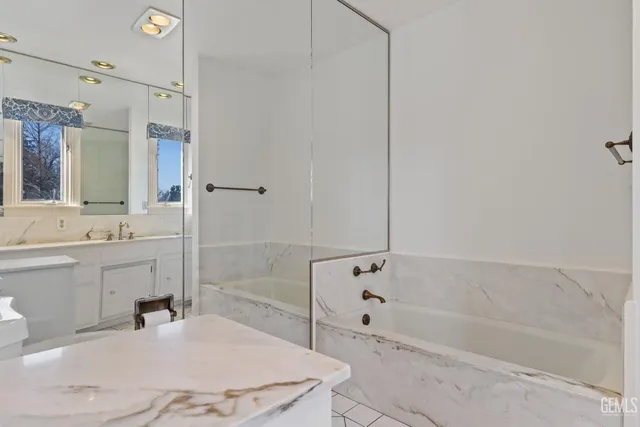 a bathroom with a bathtub and a sink