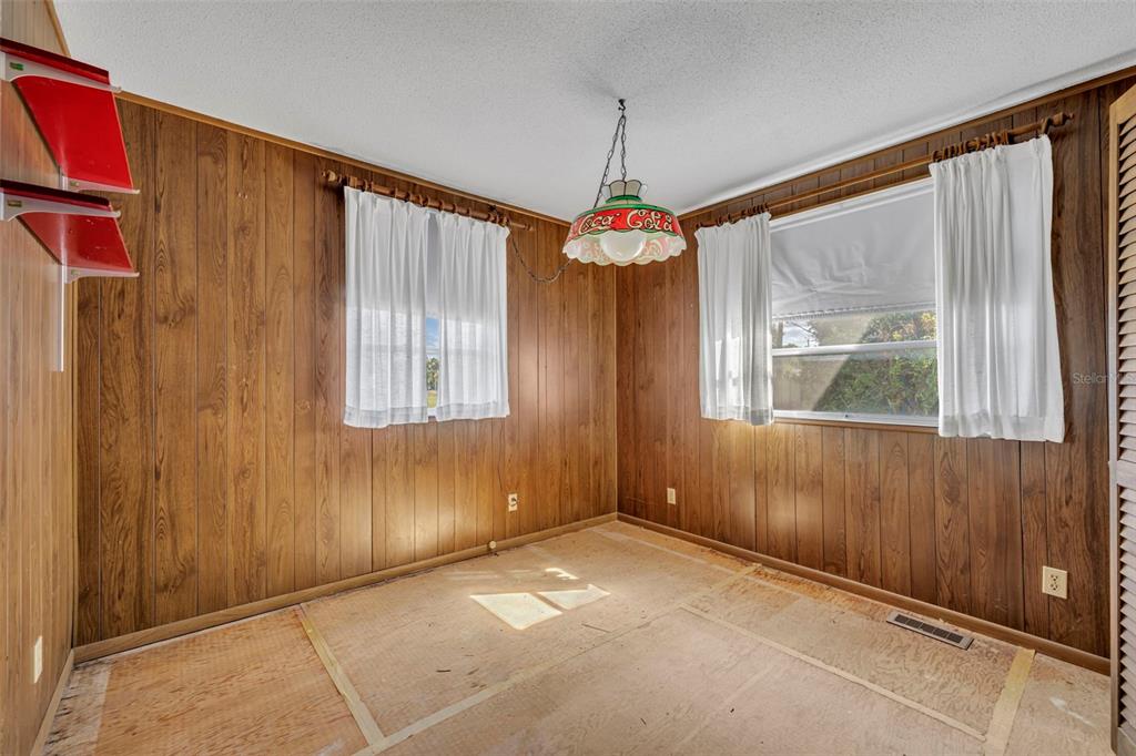 207 Perkins Street Leesburg, FL 34748 - Photo 13 of 31 a view of an empty room with a window