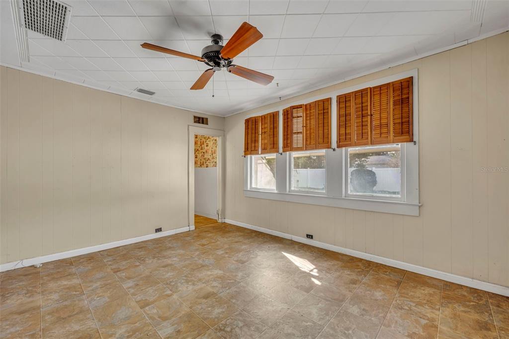 207 Perkins Street Leesburg, FL 34748 - Photo 15 of 31 a view of an empty room with a window