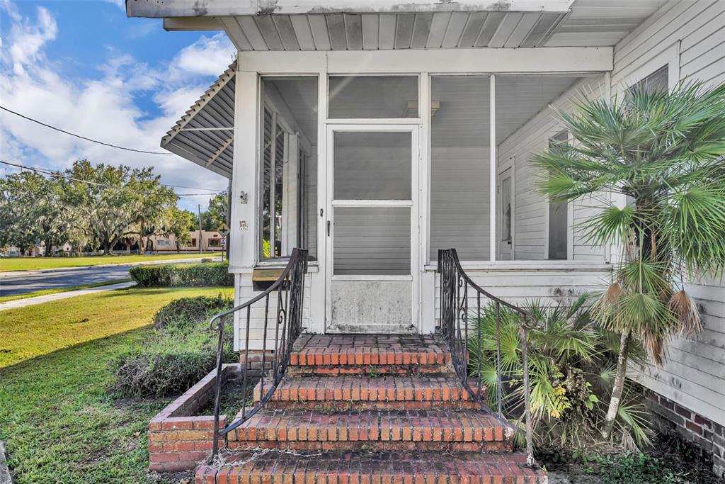 207 Perkins Street Leesburg, FL 34748 - Photo 2 of 31 a front view of a house with a yard
