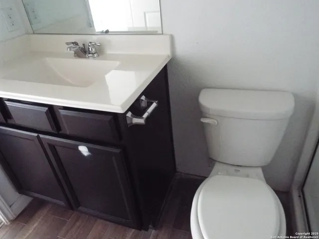 a bathroom with a toilet and a sink