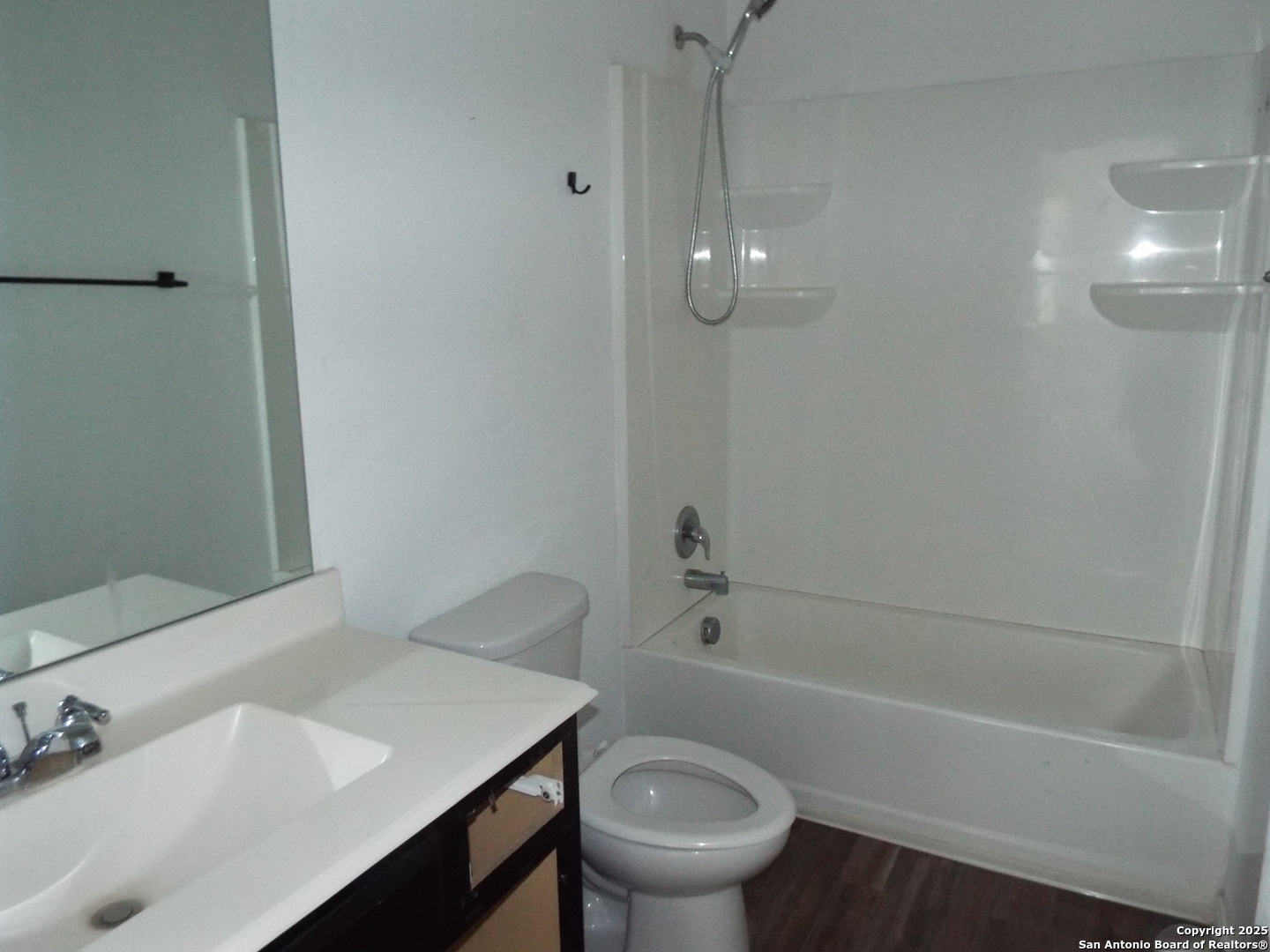 4937 Hallies Garden St. Hedwig, TX 78152 - Photo 18 of 30 a bathroom with a sink a toilet and shower