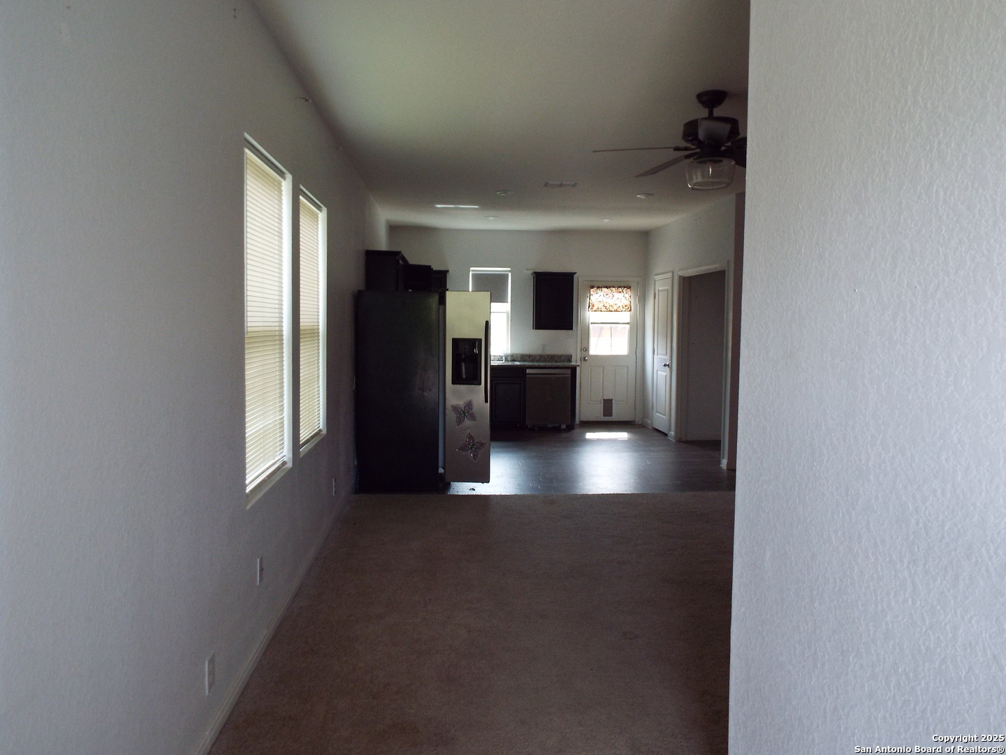 4937 Hallies Garden St. Hedwig, TX 78152 - Photo 27 of 30 a view of kitchen with refrigerator and window
