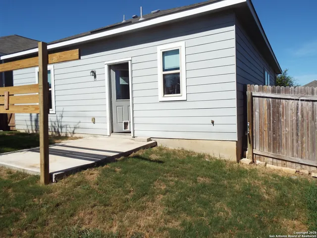 a view of front door and yard