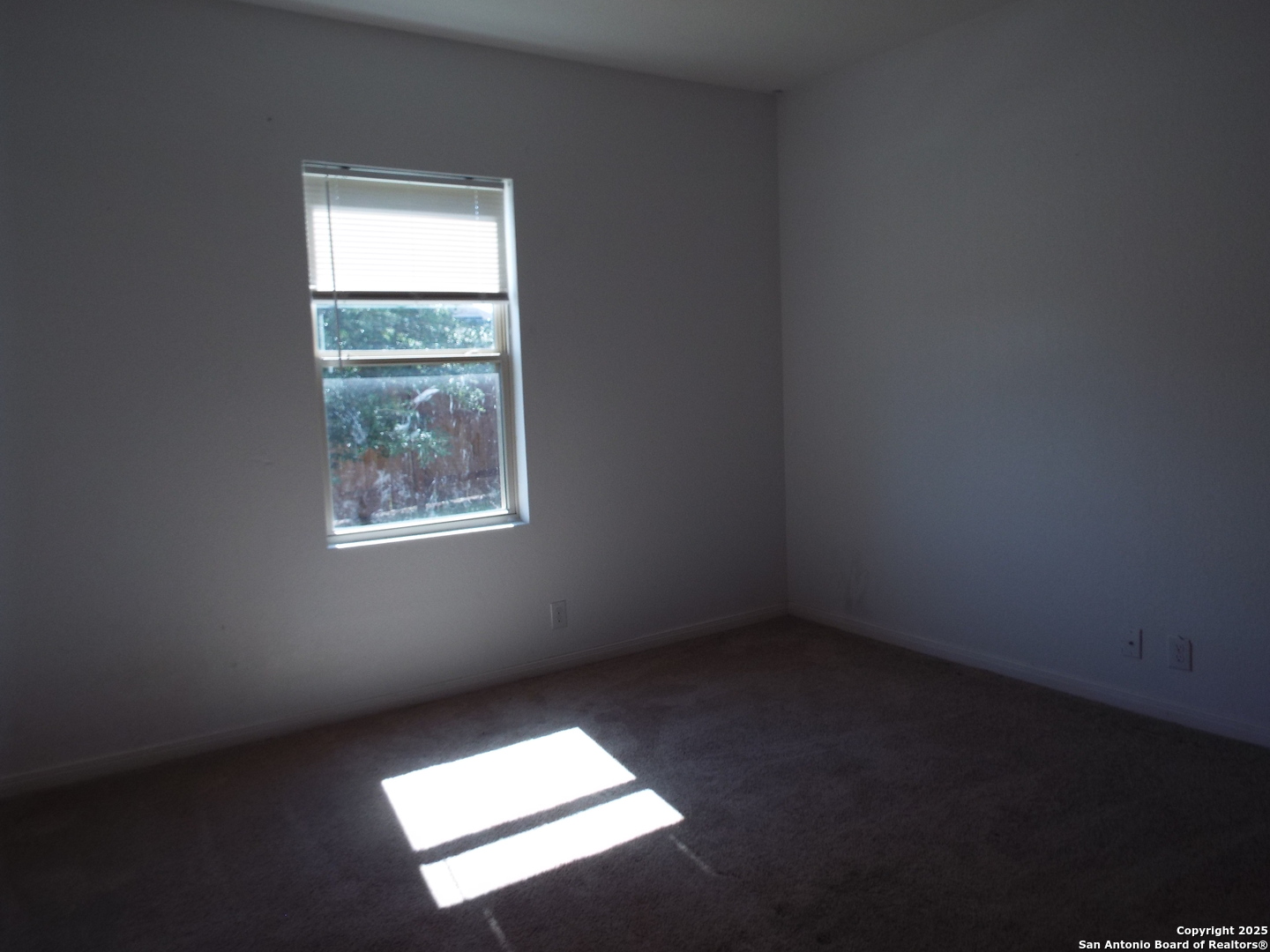 4937 Hallies Garden St. Hedwig, TX 78152 - Photo 9 of 30 an empty room with a window