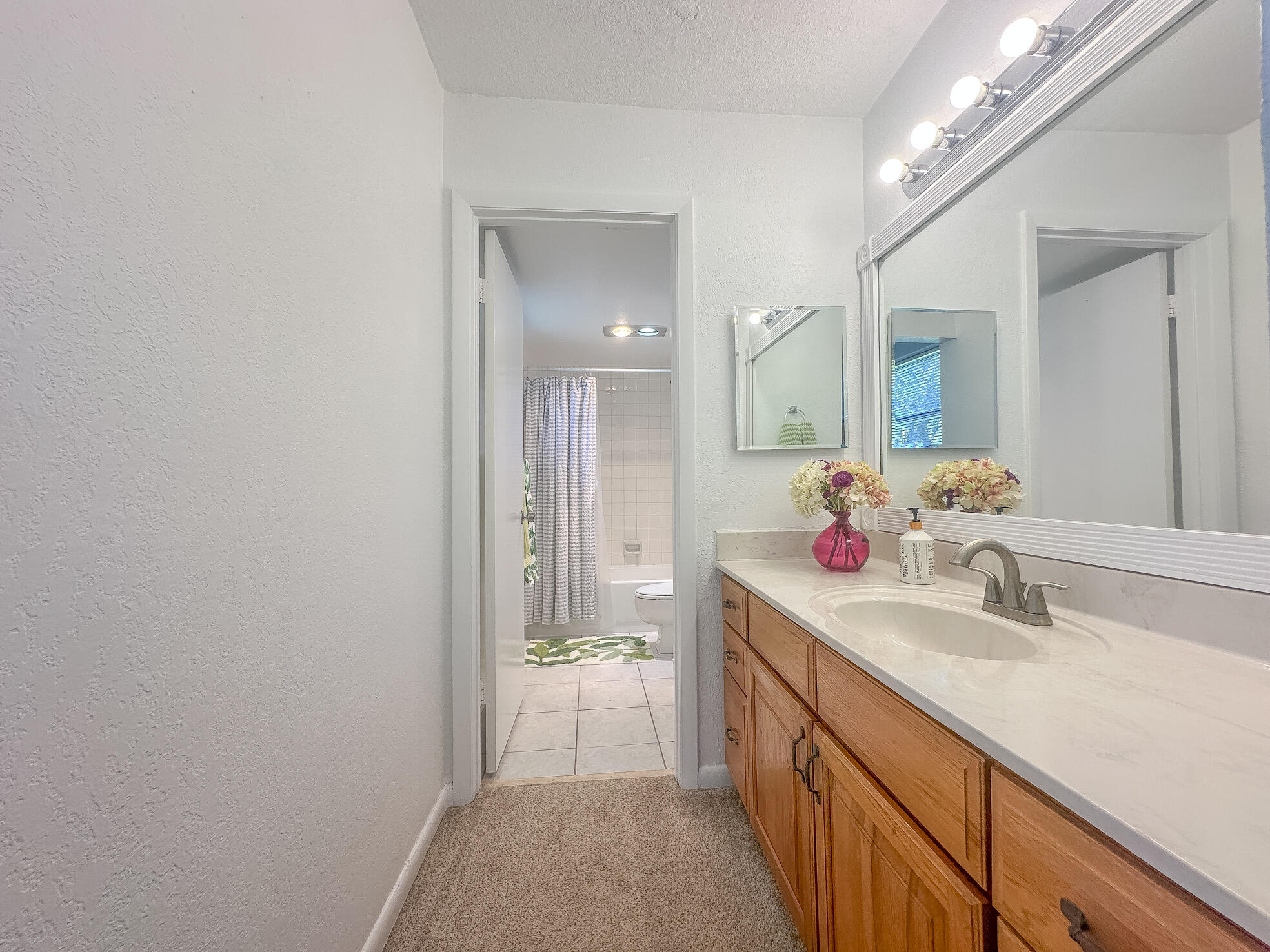 3130 Southwest 20th Terrace, Unit 13B1 Delray Beach, FL 33445 - Photo 23 of 47 a spacious bathroom with a double vanity sink mirror and