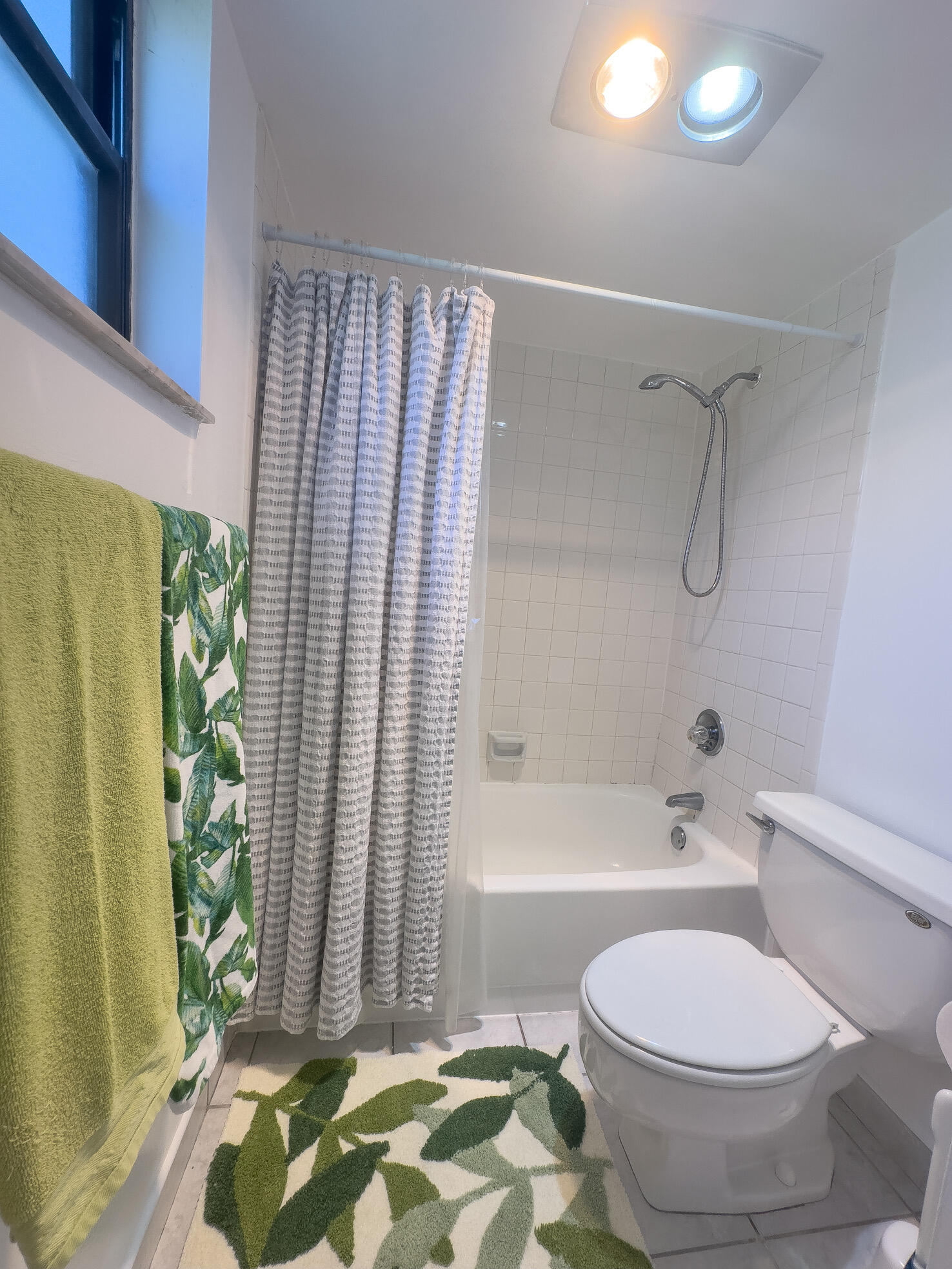 3130 Southwest 20th Terrace, Unit 13B1 Delray Beach, FL 33445 - Photo 26 of 47 a bathroom with a toilet and a shower
