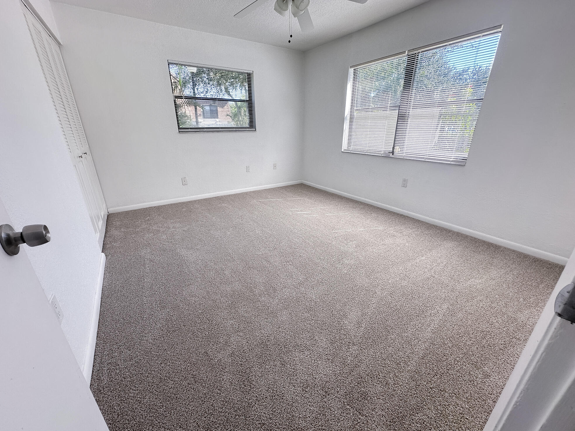 3130 Southwest 20th Terrace, Unit 13B1 Delray Beach, FL 33445 - Photo 28 of 47 a view of an empty room with a window