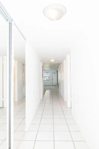 a view of an house with backyard and porch