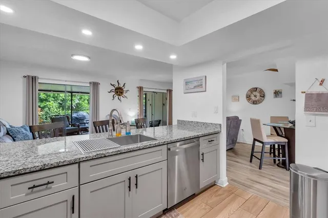 a bathroom with double vanity and a mirror