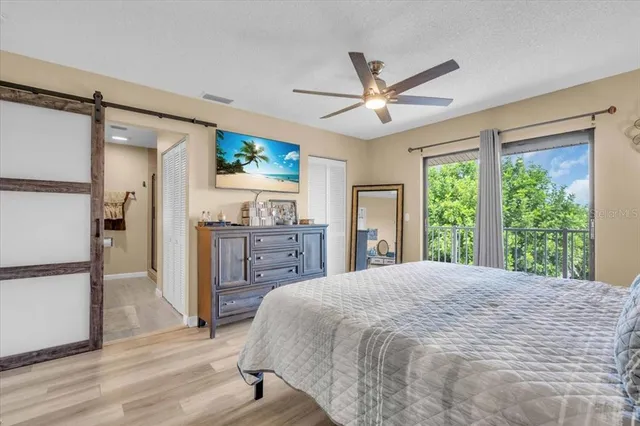 a bed room with a bed and a chandelier