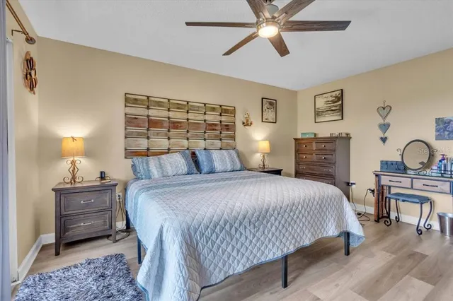 a bathroom with a granite countertop sink mirror vanity and toilet