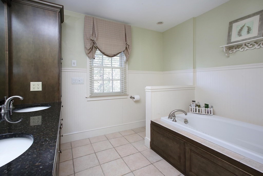 24 Arlington Road Brookline, MA 02467 - Photo 15 of 25 a bathroom with a sink a toilet and a tub