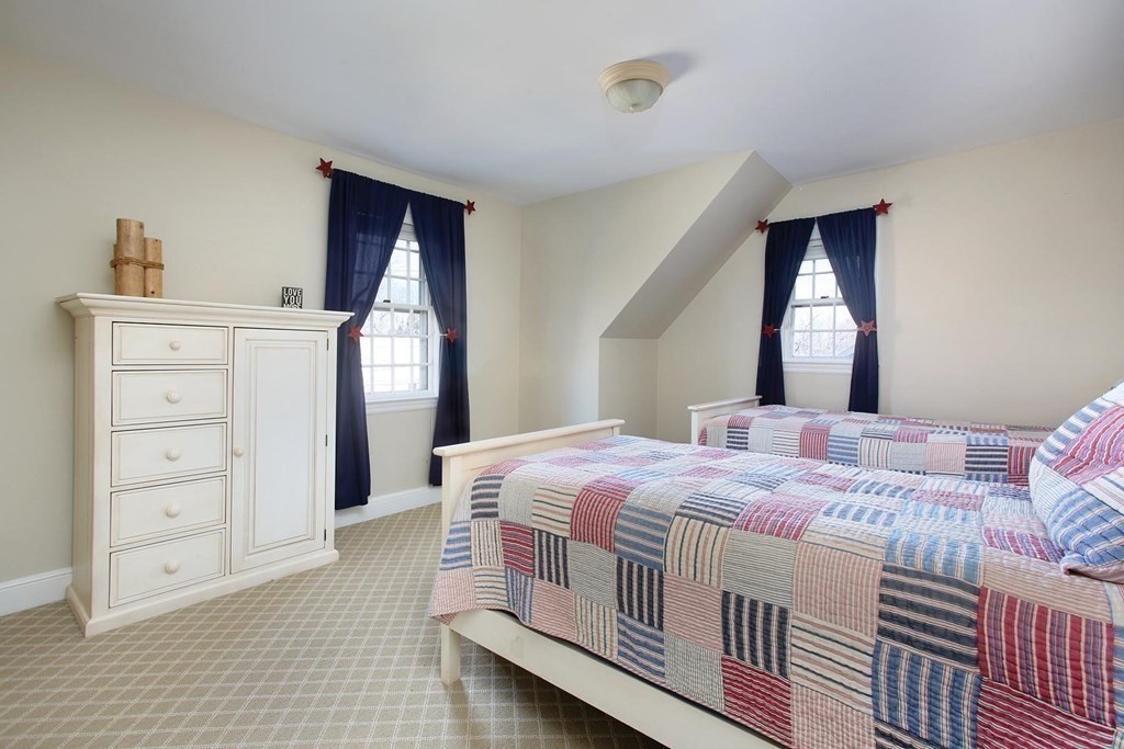 24 Arlington Road Brookline, MA 02467 - Photo 16 of 25 a bedroom with a bed and a window