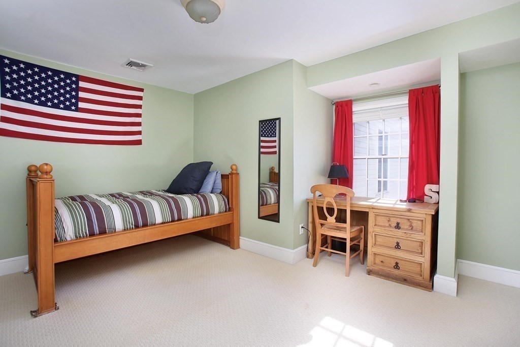 24 Arlington Road Brookline, MA 02467 - Photo 17 of 25 a living room with furniture and a dresser