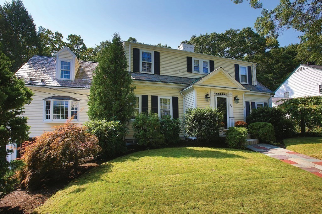 24 Arlington Road Brookline, MA 02467 - Photo 2 of 25 a front view of a house with garden