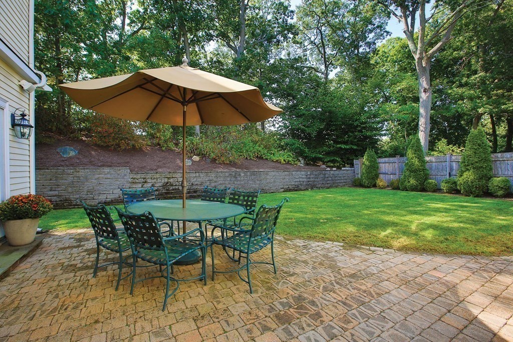 24 Arlington Road Brookline, MA 02467 - Photo 23 of 25 a view of a table and chairs under an umbrella