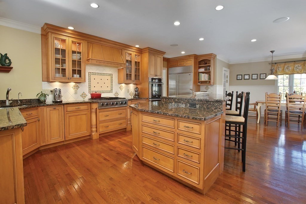 24 Arlington Road Brookline, MA 02467 - Photo 6 of 25 a kitchen with stainless steel appliances granite countertop a sink and cabinets
