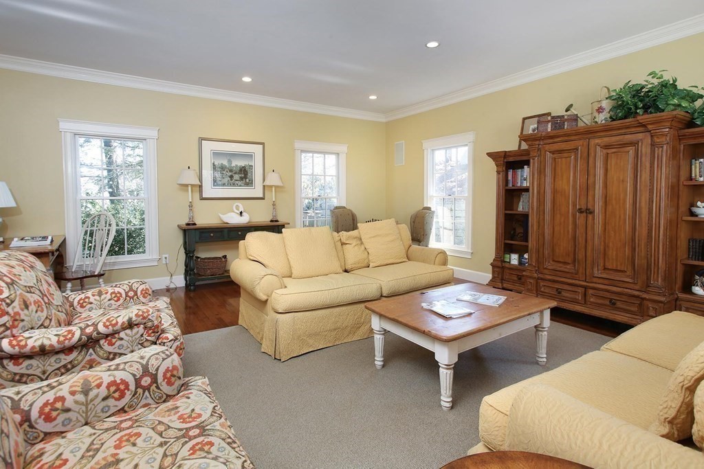 24 Arlington Road Brookline, MA 02467 - Photo 9 of 25 a living room with furniture a wooden floor and a window