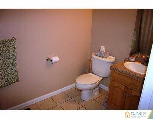 1115 Edpas Road New Brunswick, NJ 08901 - Photo 7 of 8 a bathroom with a toilet and a sink