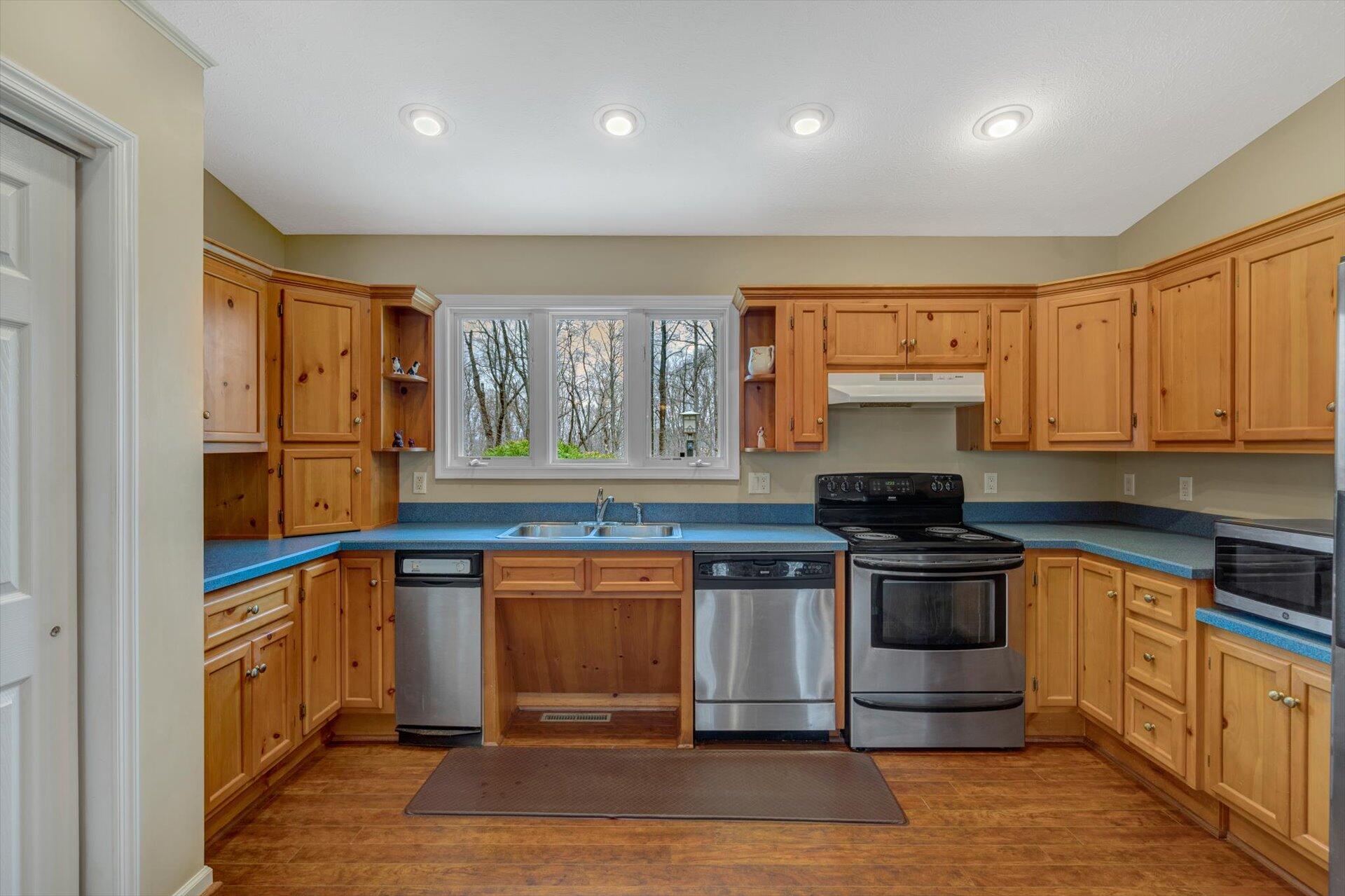 95 Echowood Lane Hardy, VA 24101 - Photo 12 of 46 a kitchen with stainless steel appliances granite countertop a stove and a sink