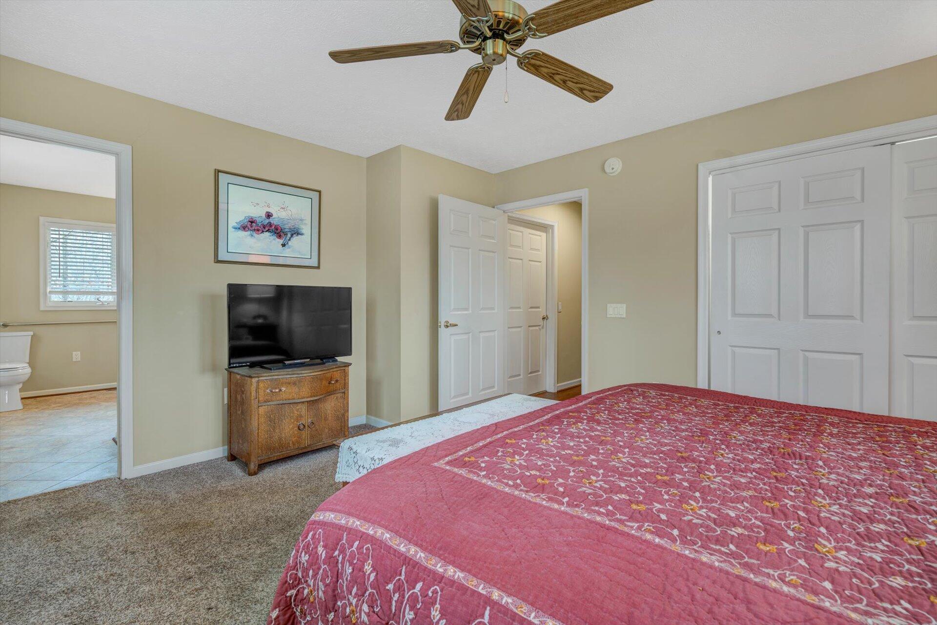 95 Echowood Lane Hardy, VA 24101 - Photo 18 of 46 a bedroom with a bed and a flat screen tv