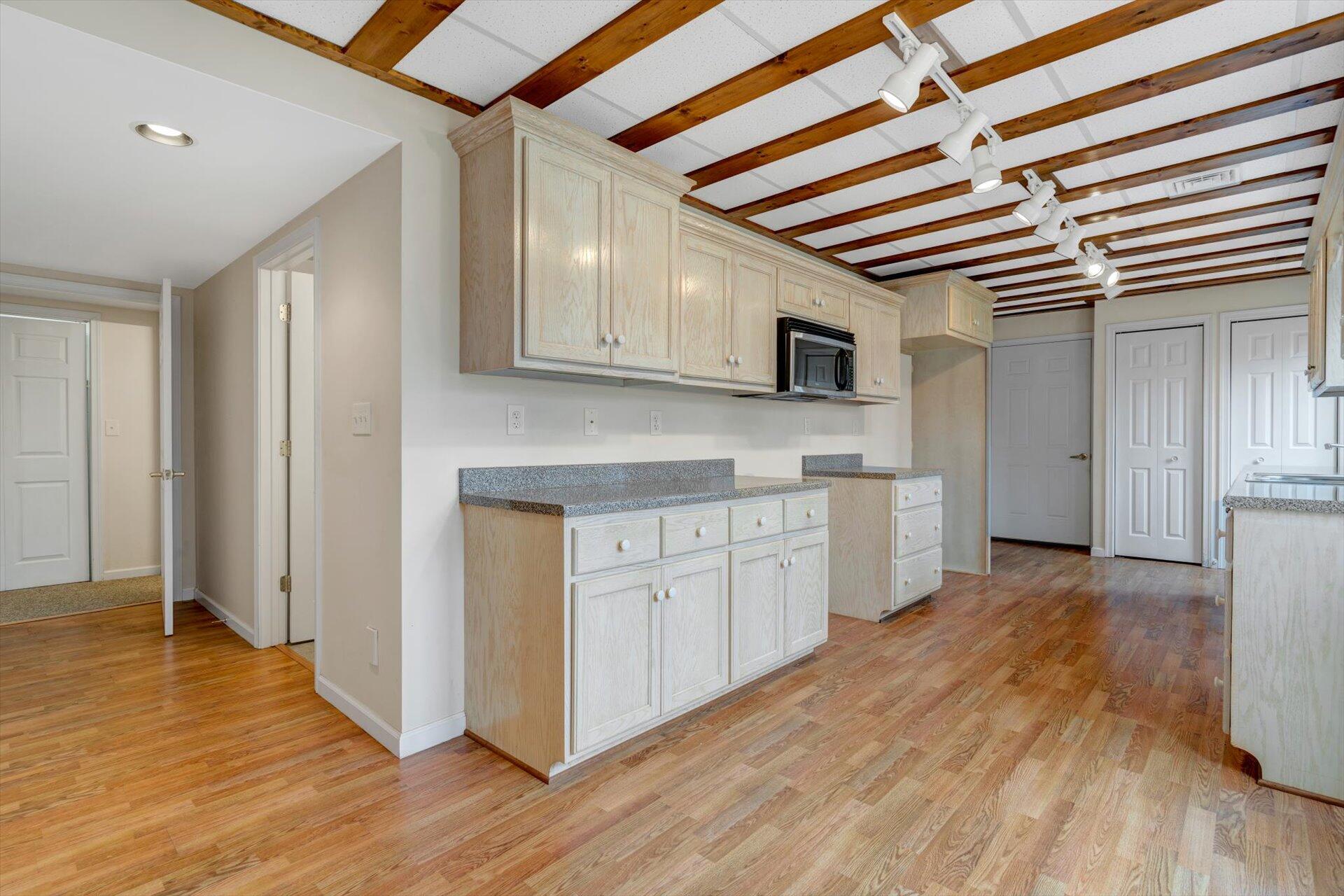 95 Echowood Lane Hardy, VA 24101 - Photo 23 of 46 a kitchen with stainless steel appliances granite countertop a refrigerator and a stove top oven