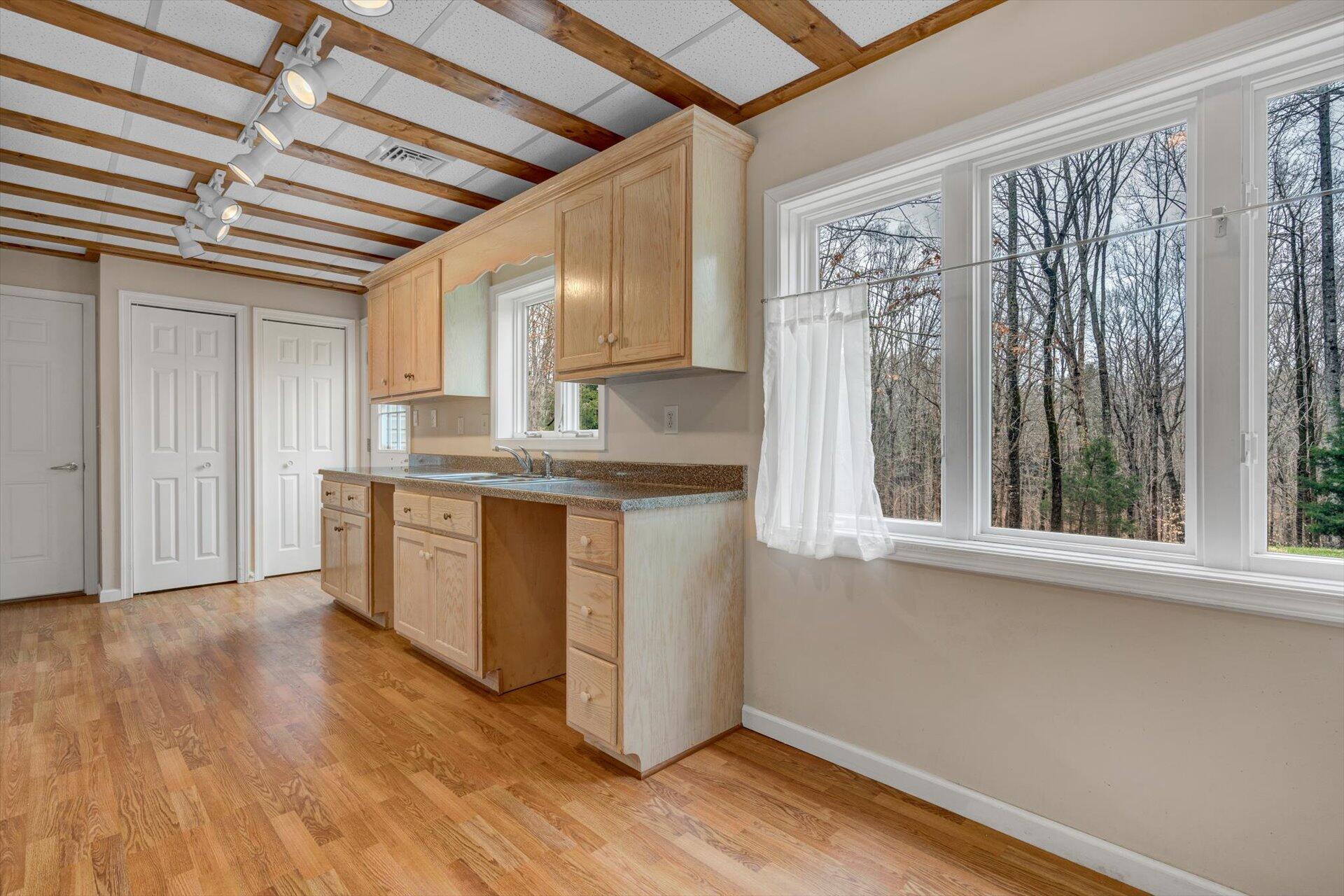 95 Echowood Lane Hardy, VA 24101 - Photo 24 of 46 a kitchen with stainless steel appliances granite countertop a stove a sink and a microwave