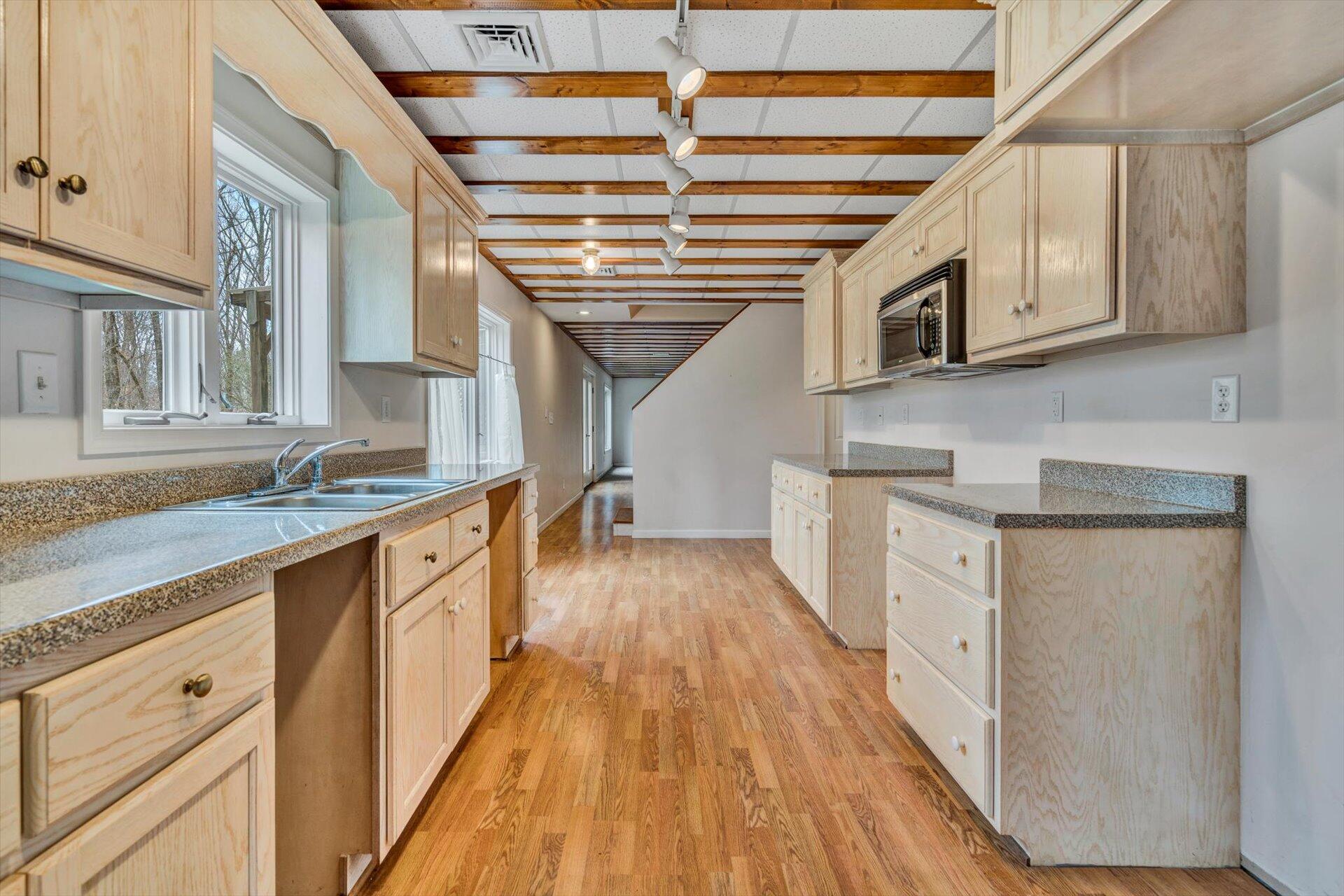 95 Echowood Lane Hardy, VA 24101 - Photo 25 of 46 a kitchen with stainless steel appliances granite countertop a sink and cabinets