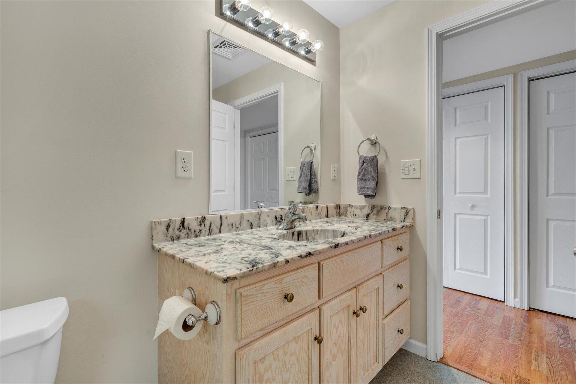 95 Echowood Lane Hardy, VA 24101 - Photo 28 of 46 a bathroom with a granite countertop sink and a mirror