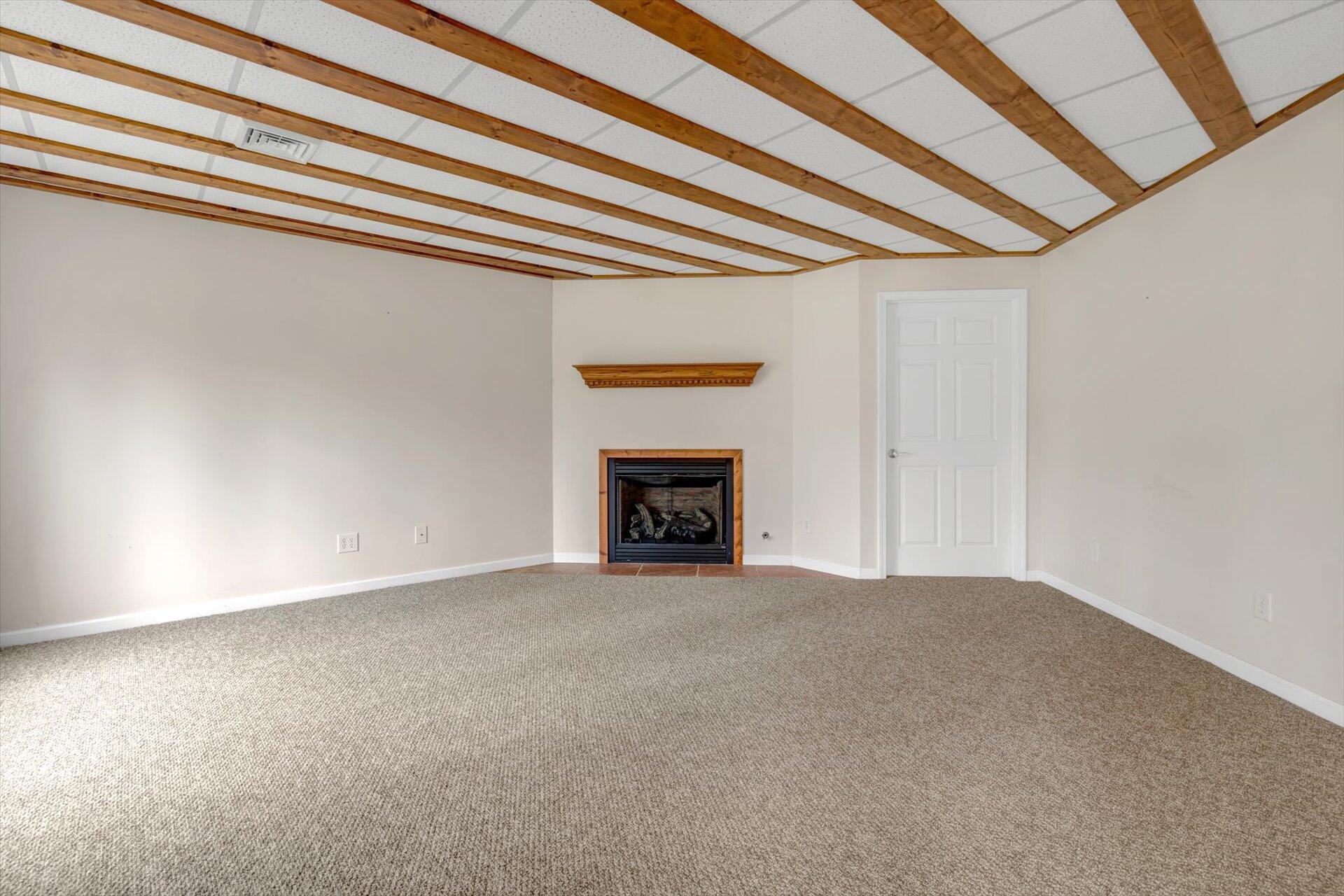 95 Echowood Lane Hardy, VA 24101 - Photo 33 of 46 a view of an empty room with a fireplace and a window