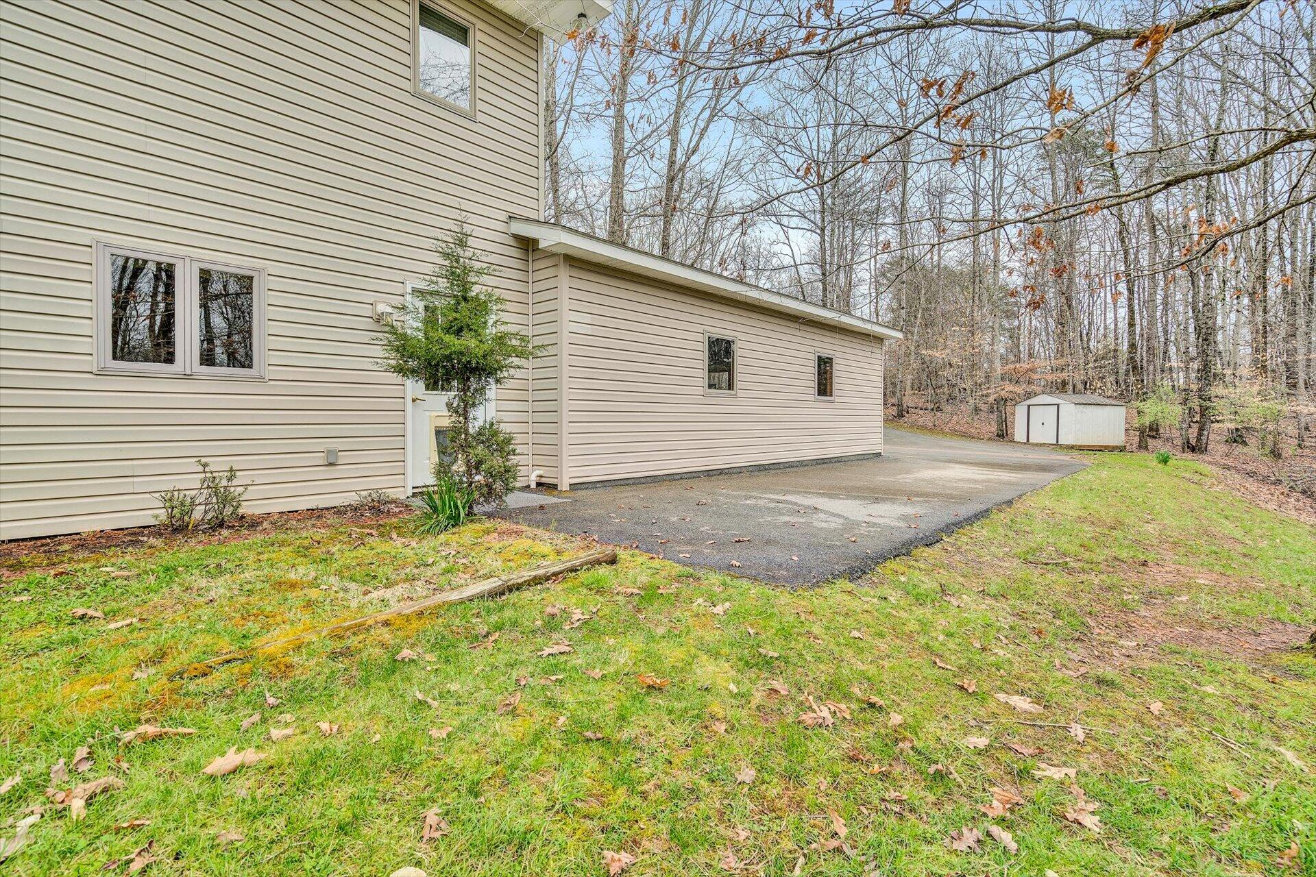 95 Echowood Lane Hardy, VA 24101 - Photo 38 of 46 a view of a backyard with a garden