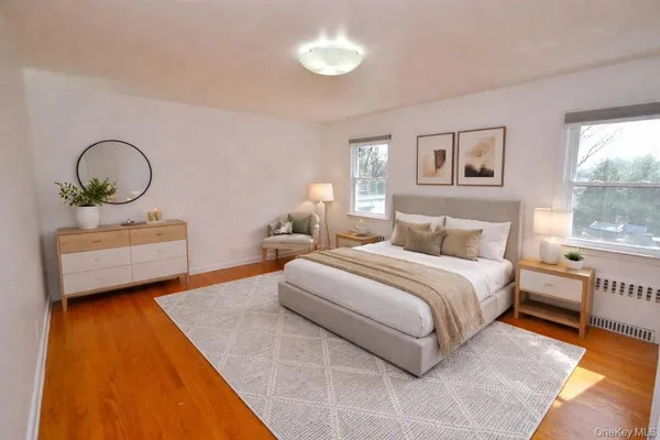 a bedroom with a bed and a night stand