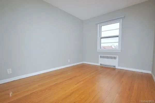 a view of an empty room and a window