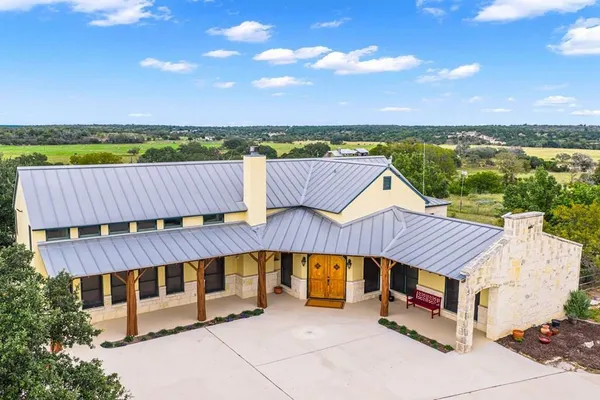 an outdoor sitting area with a table and chair