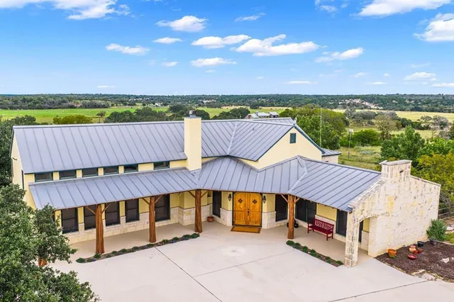 an outdoor sitting area with a table and chair