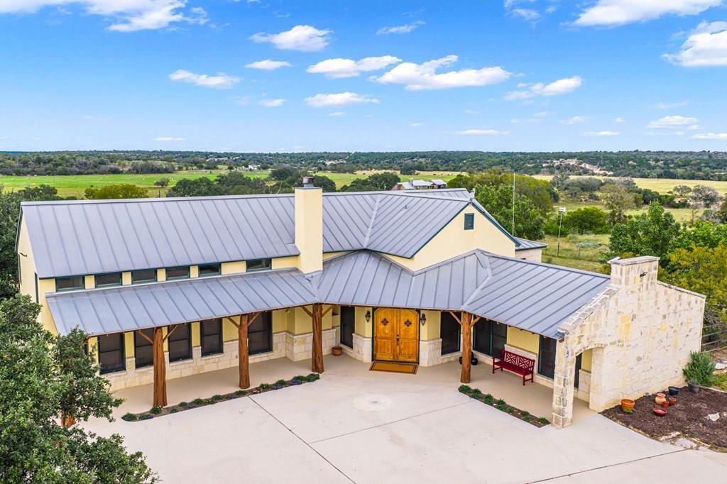 an outdoor sitting area with a table and chair